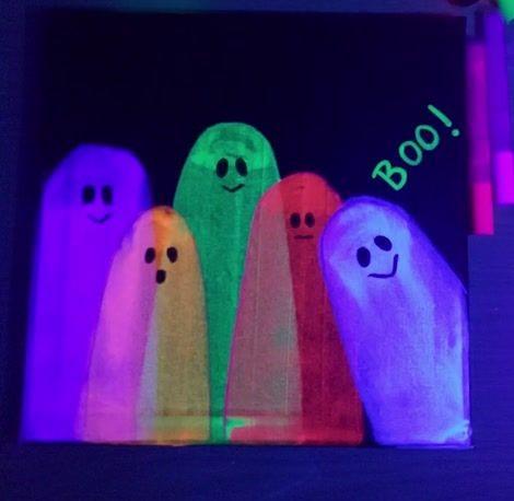 painting of five ghosts in different neon colors, glowing under a blacklight