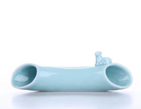 light blue noodle-shaped ceramic cellphone speaker
