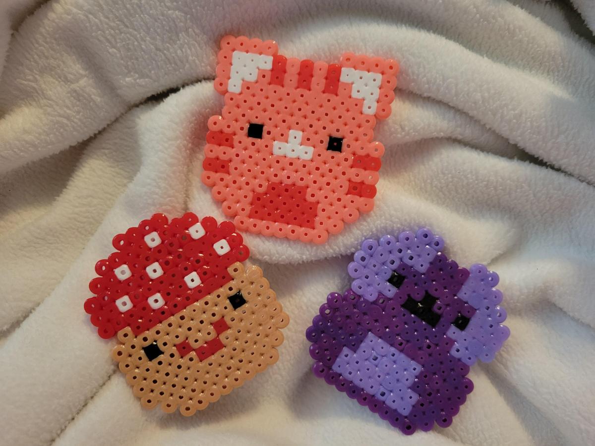 mushroom, pink cat and owl squishmallows made out of perler beads